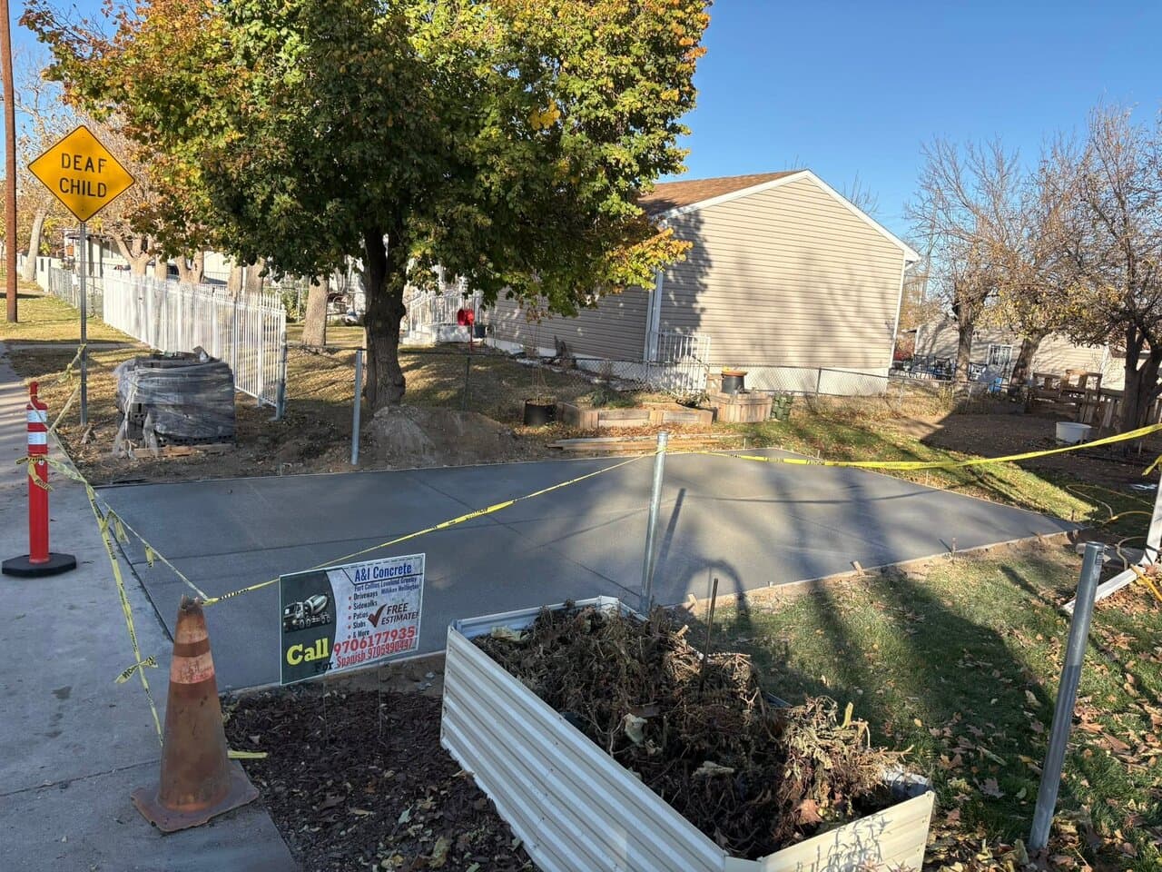 Concrete foundation with caution tape and barriers