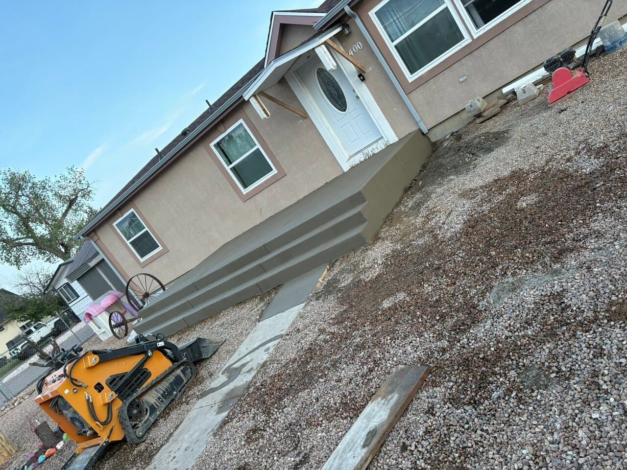 Landscaping work in progress with compact track loader