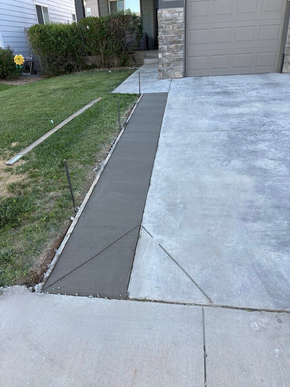 Completed concrete driveway and sidewalk