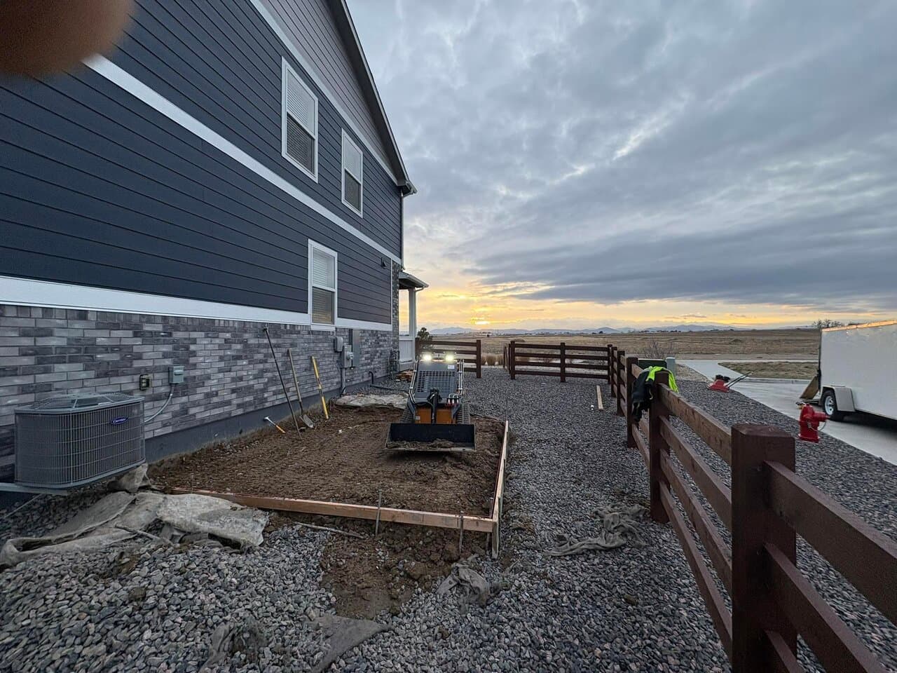 A&I Concrete crew preparing a foundation pour at dusk